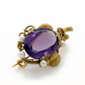 Broche en or jaune avec améthyste