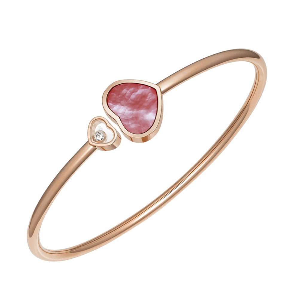 Happy Hearts rigid bracelet in rose gold with a pink mother-of-pearl heart and a heart with a moving diamond