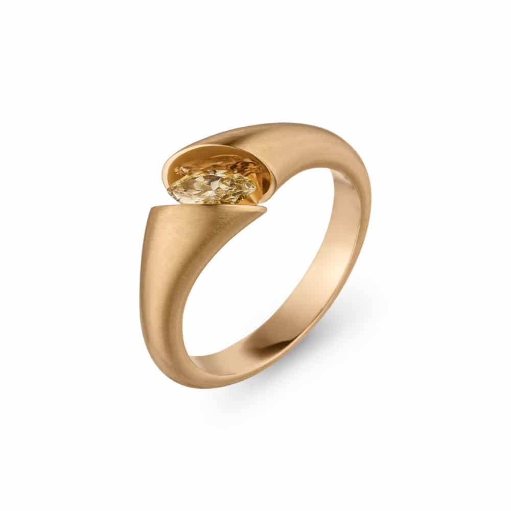 Calla Solitaire in satin rose gold set with a marquise-cut diamond