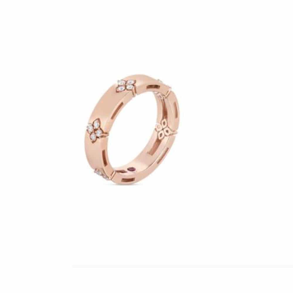 Pink gold ring set with 20 diamonds and a ruby