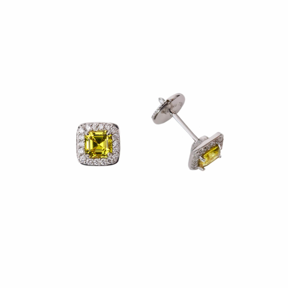 White gold ear studs set with yellow sapphires