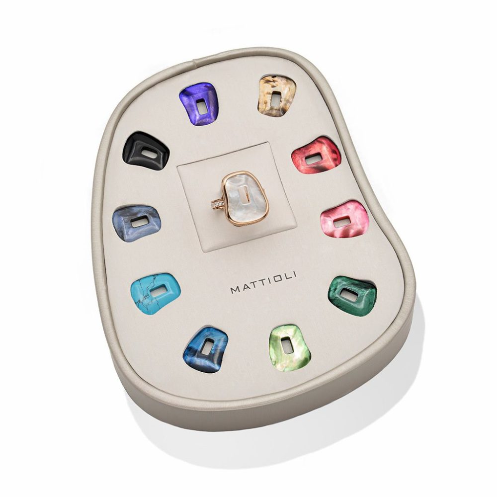 Puzzle ring in pink gold set with white diamonds and 11 interchangeable mother-of-pearl stones