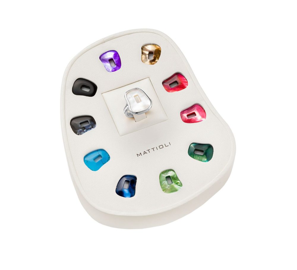 Puzzle ring in white gold set with white diamonds and 11 interchangeable mother-of-pearl stones