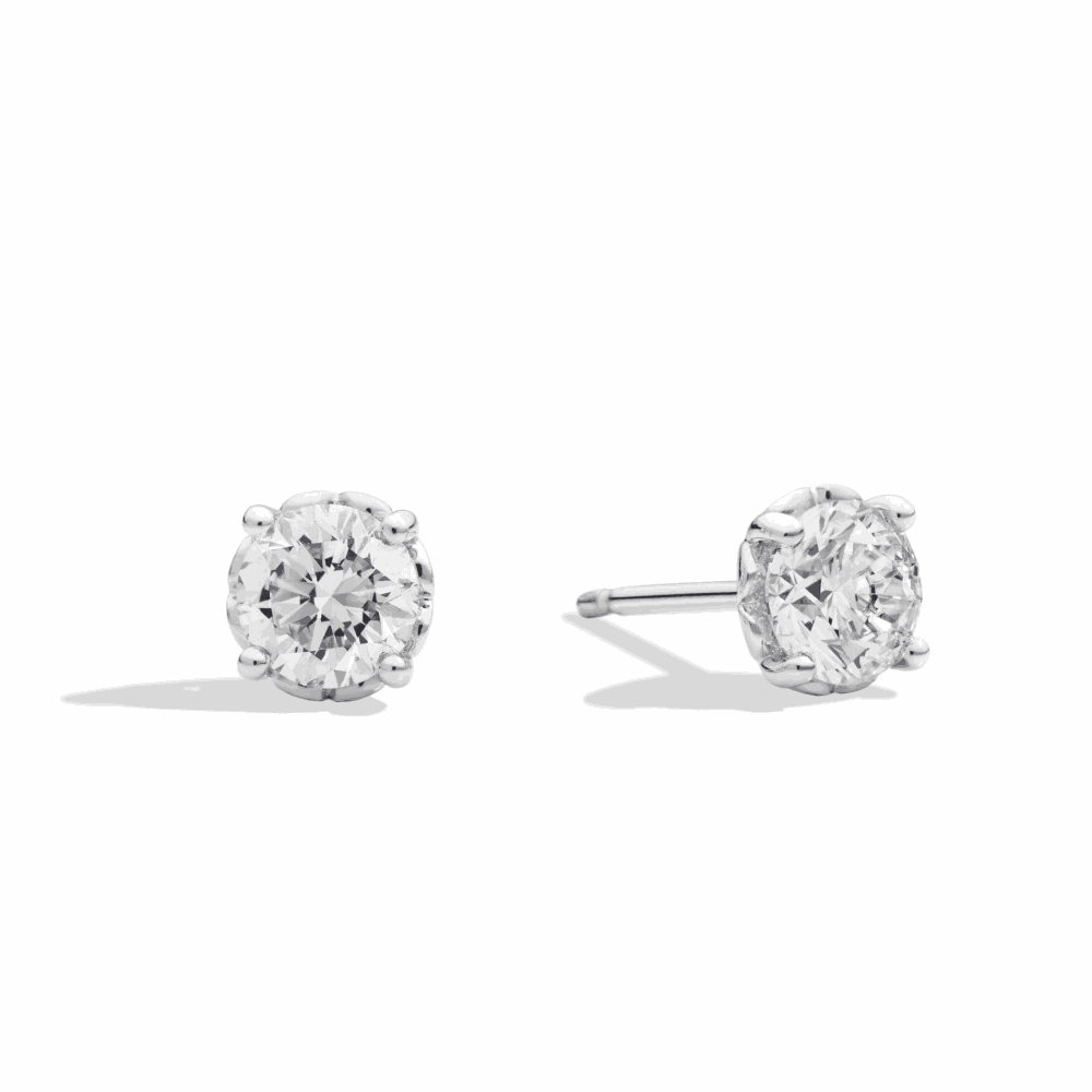 Clous d’oreilles en or blanc serti de deux diamants total 0.20ct