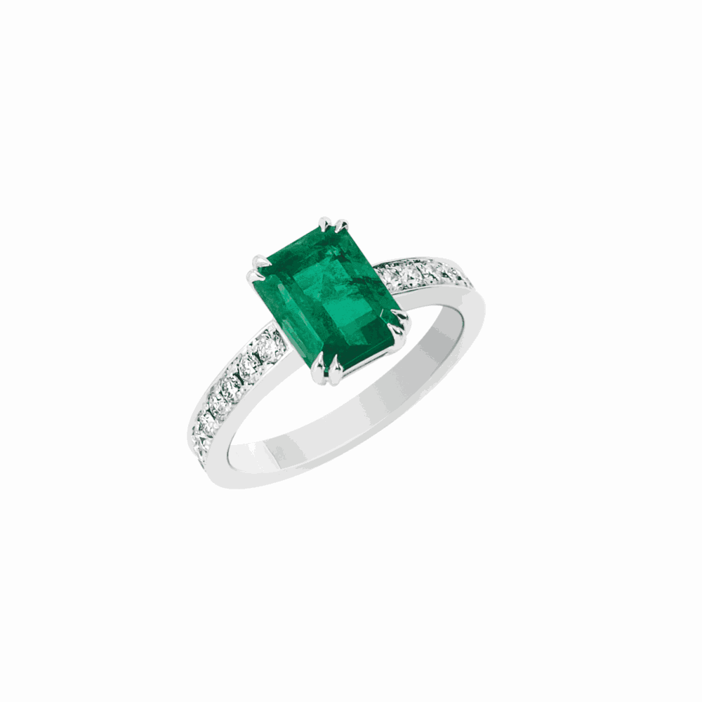 White gold ring set with an emerald and diamonds